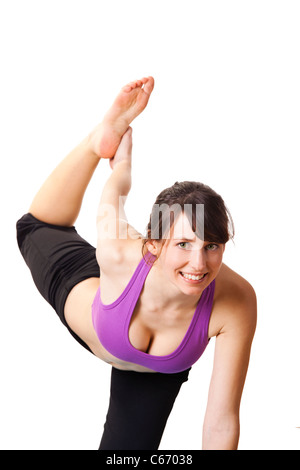 Schöne und sportliche junge Frau, die Yoga-Übungen Stockfoto