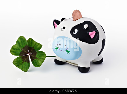 Sparschwein mit vier blätterte Klee Stockfoto