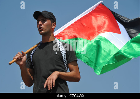 Eine unterdrückte Demonstration durch die israelischen Streitkräfte in den palästinensischen Dorf von Nabi Salih., eines Demonstrators mit der Palästina Stockfoto