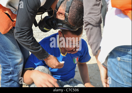 Eine unterdrückte Demonstration von den israelischen Streitkräften in den palästinensischen Dorf von Nabi Salih., erstickt ein Demonstrator, Stockfoto