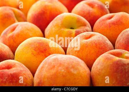 Ripe fresh peaches as background close up Stockfoto
