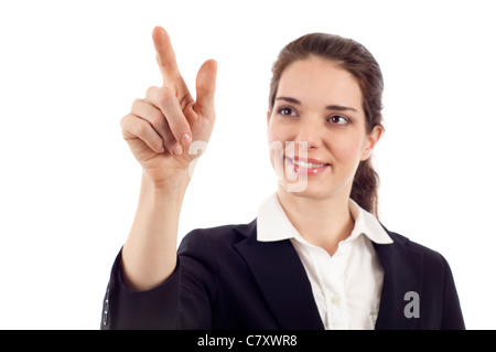 Lächelnde Geschäftsfrau zeigt auf dem Bildschirm zu isoliert auf weißem Hintergrund Stockfoto