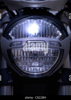 An image of a motorcycle headligh up close Stockfoto