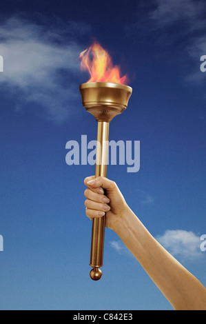 Hand halten flammende baton Stockfoto