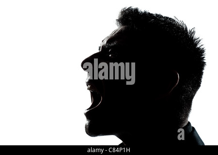 ein Mann Porträt Silhouette Profil schreien wütend im Studio weißen Hintergrund isoliert Stockfoto