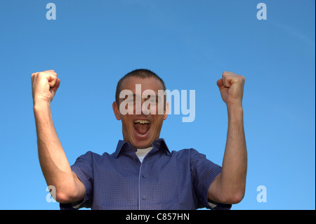 Junger Trainer freut sich Stockfoto