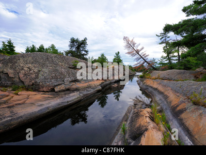 Die schlechte Flussgebiet von Georgian Bay ist berühmt für es gute Angelmöglichkeiten und spektakuläre Landschaften.  Es ist nur mit Boot erreichbar Stockfoto