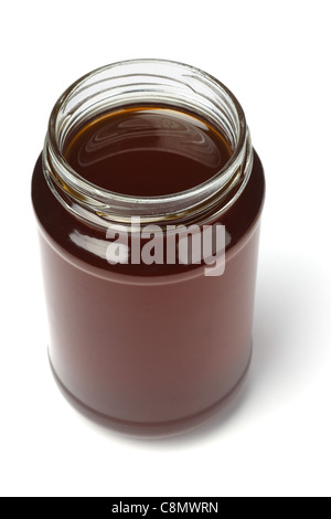 Erhöhten Blick auf einem offenen Glas Honig auf weißem Hintergrund Stockfoto