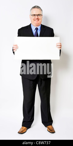 Business-Mann hält eine Sandwichplatte Stockfoto