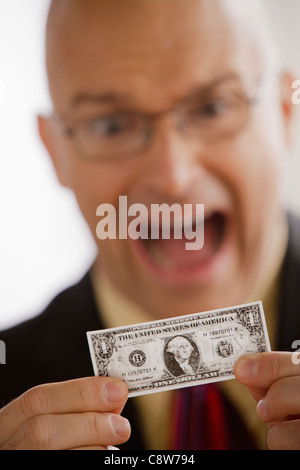 Porträt der Geschäftsmann mit einem Dollarschein Stockfoto