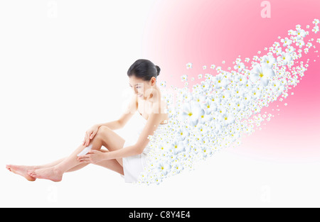 Frau mit vielen weißen Blüten Stockfoto