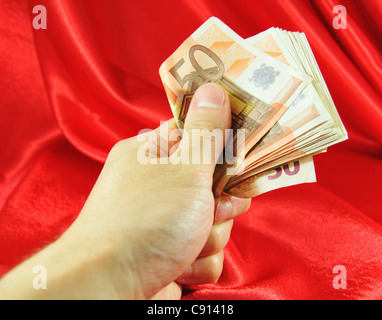 Hand, die Euro-Banknoten Stockfoto