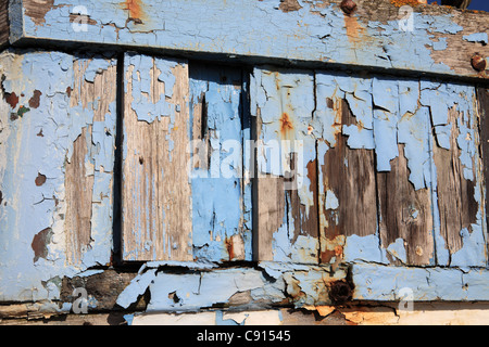 Detailansicht der abblätternde Farbe auf altes Fischerboot auf dem Stade, Hastings, East Sussex, UK Stockfoto