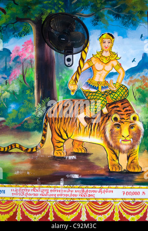 Wandbild der Gottheit mit Fledermaus auf Tiger, Wat Mixayaram, Vientiane, Lao, Asien Stockfoto