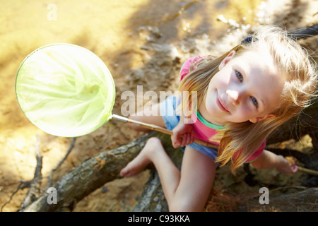 Junges Mädchen mit Fischernetz Stockfoto