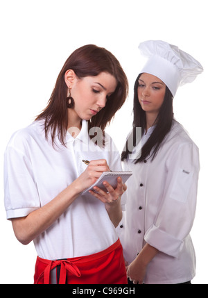 Service und Koch, die Diskussion über das Menü zusammen Stockfoto