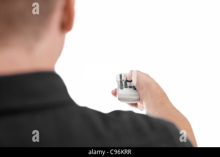 Männliches Model Tasten auf der Fernbedienung drücken. Menschen und Dinge in unterschiedlichen Lebenssituationen. Stockfoto