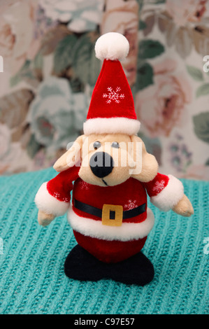 Der Weihnachtsmann (Santa Claus) Kuscheltier Hund Stockfoto