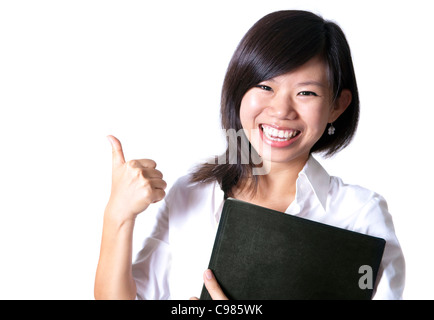 Eine asiatische Mädchen geben Daumen nach oben Zeichen und hält eine Datei Stockfoto