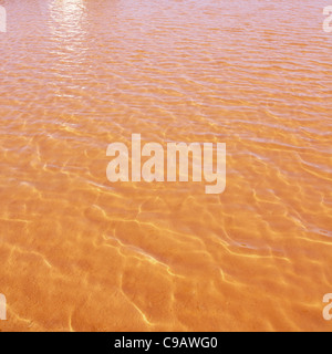 Formentera Ses Salines Saline rot orange Wasser der Seen mit Wellen Wellen Stockfoto