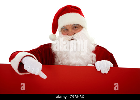 Foto von happy Santa Claus mit roten Plakat darauf zeigen Stockfoto