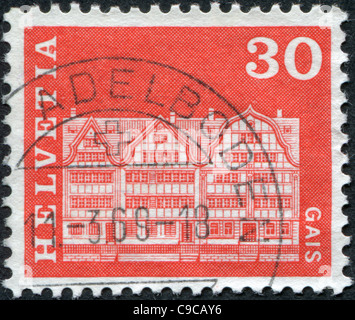 1968 Schweiz: Eine Briefmarke gedruckt in der Schweiz, zeigt am Dorfplatz in Gais Stockfoto