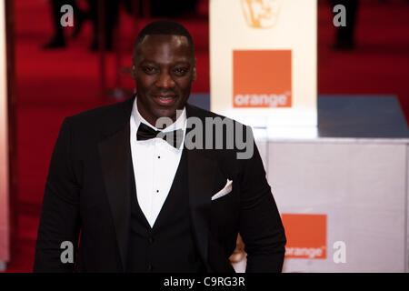 London, UK, 02.12.2012. Schauspieler, Adewale Akinnuoye-Agbaje, Ankunft auf den roten Teppichen in den BAFTAs 2012 Stockfoto