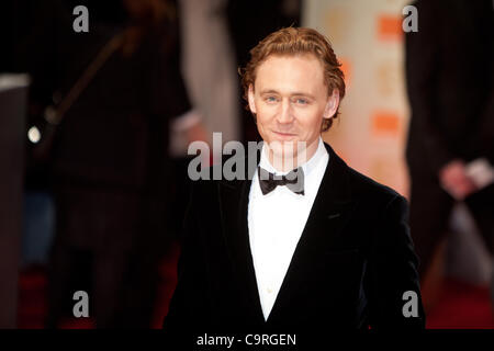 London, UK, 02.12.2012. Schauspieler, Tom Hiddlestone, Ankunft in 2012 BAFTAs Stockfoto