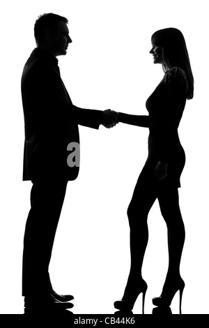 eine kaukasische paar Mann und Frau Handshake Studio Silhouette isoliert auf weißem Hintergrund Stockfoto