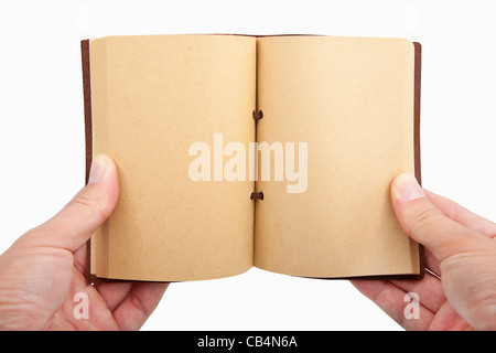 Aufgeschlagenes Buch in der Hand isoliert auf weißem Hintergrund Stockfoto