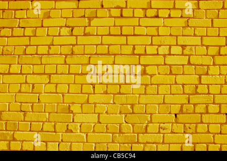 bemalte Ziegel gelbe Wand Hintergrund und Struktur Stockfoto