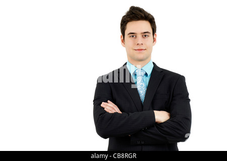 Hübscher junger Mann in einem formellen Business-Anzug mit Arme gekreuzt. Stockfoto