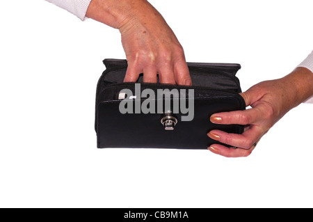 Womans Weibchen Personen Hände erreichen In A Purse Stockfoto