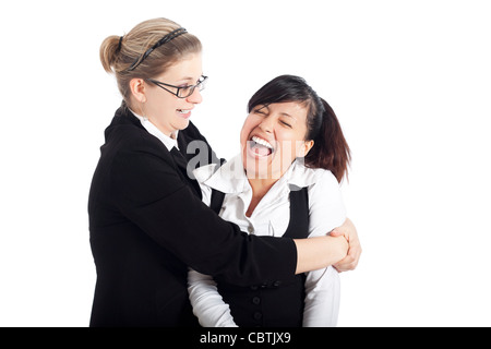 Zwei junge glücklich Business Frauen lustige Szene, isoliert auf weißem Hintergrund. Stockfoto