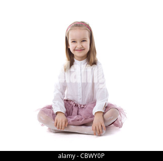 Schönes junges Mädchen sitzt mit ihrem gekreuzten Beinen Stockfoto