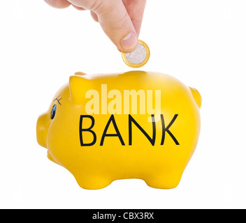 Geschäftsmann, Geld in Sparschwein. Stockfoto