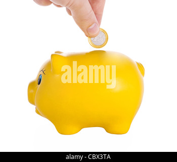 Geschäftsmann, Geld in Sparschwein. Stockfoto