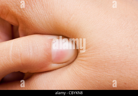 Druck auf einen Druckpunkt Stockfoto