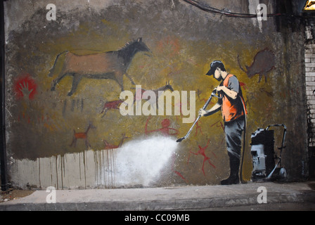 Banksy Graffiti, ironischer Kommentar von prähistorischen Höhle Graffiti abwaschen Stockfoto