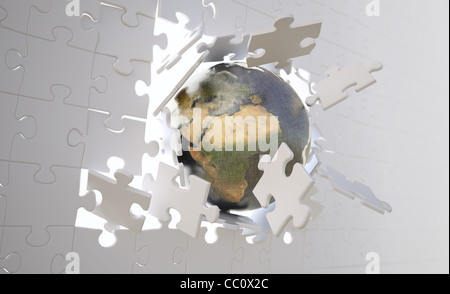 Metallische Erdkugel Absturz durch eine Mauer bauen von Jigsaw Puzzle-Teile. Stockfoto