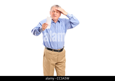 Ein überrascht reifer Mann betrachten Shop Eingang Stockfoto