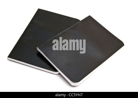 Kleine Notebooks, die isoliert auf weißem Hintergrund Stockfoto