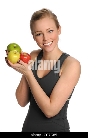 Schöne junge Frau, die mit frischen Äpfeln isoliert auf weißem Hintergrund Stockfoto