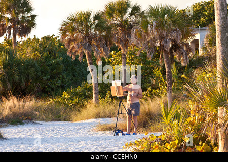 Ein Künstler malt eine Szene am berühmten Siesta Key Beach, Sarasota Florida Stockfoto