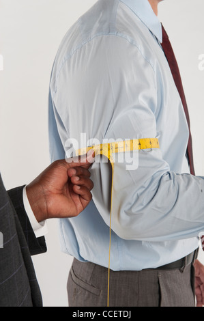 Schneider der Messung eines Kunden Stockfoto