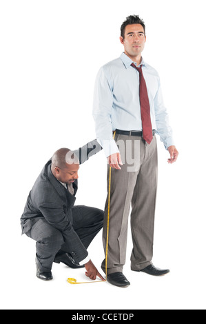 Schneider unter Maßnahme Bein des Kunden Stockfoto