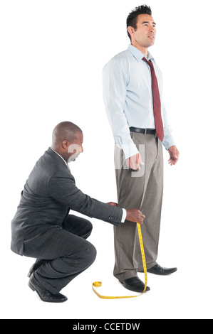 Afrikanische Schneider Maßnehmen Stockfoto