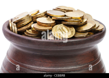 Nahaufnahme von Goldmünzen in einem Topf Stockfoto