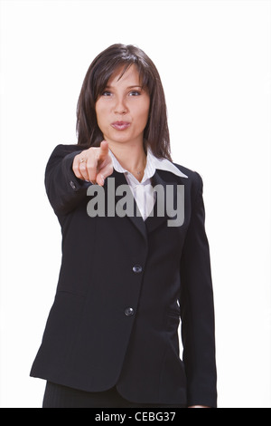Geschäftsfrau mit ihrem Finger auf einem weißen Hintergrund. Stockfoto