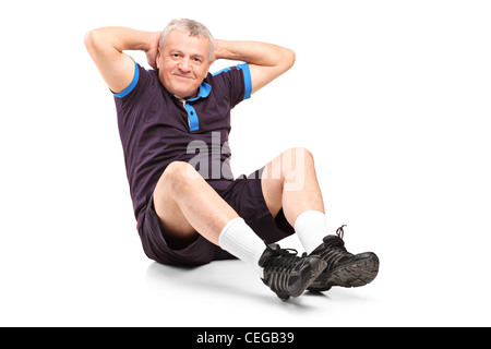 Einen mittleren Alters, die senior woman Ausübung auf weißem Hintergrund isoliert Stockfoto